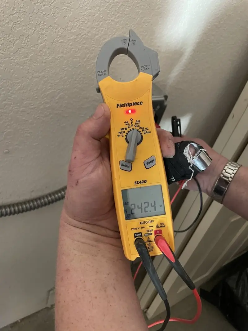 Voltage testing with clamp meter during Electrical Installation Services in Cayuga Heights